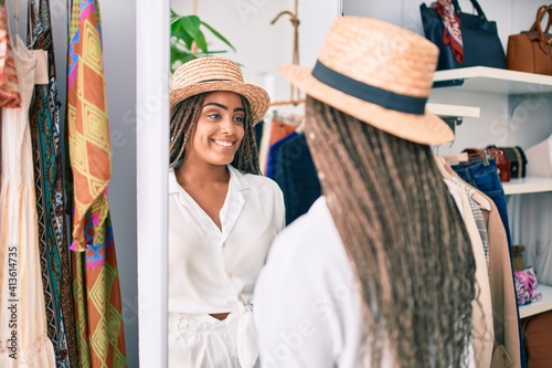 Young african american woman smiling happy at retail shop