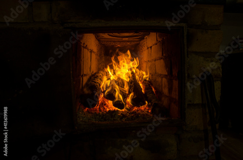 the fire burns brightly in the fireplace  in the stove