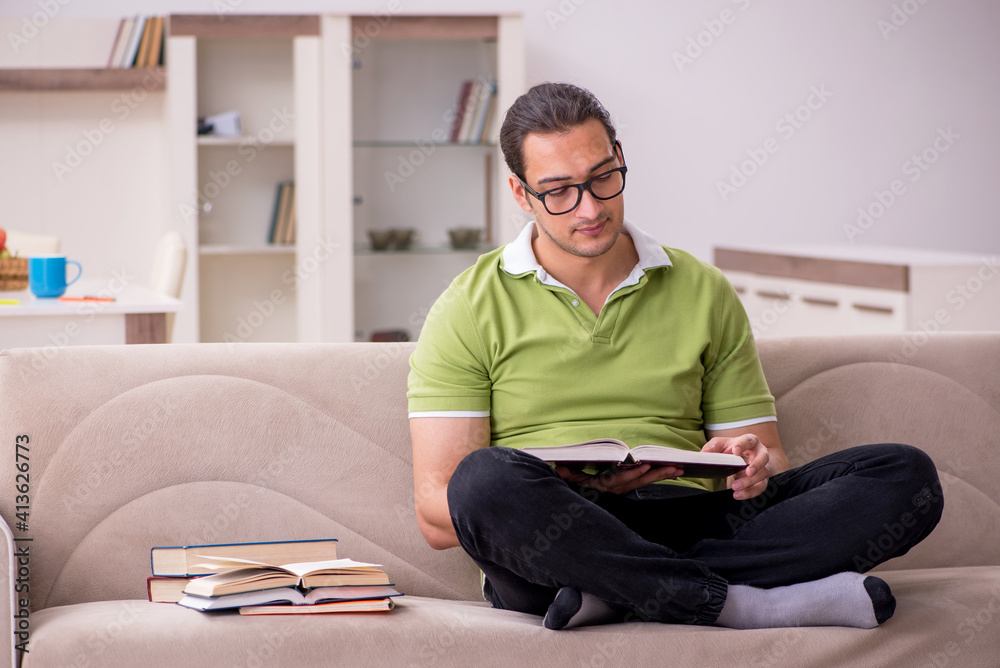 Young male student preparing for exams at home Young male student preparing for exams at home