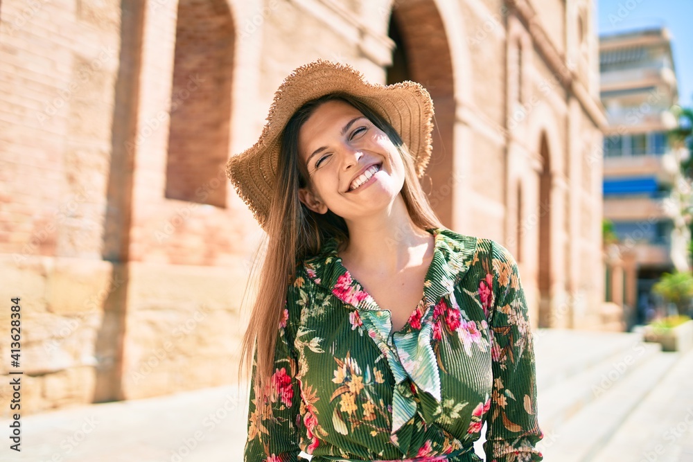 Beautiful caucasian woman smiling happy on a sunny day outdoors