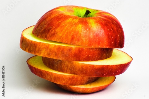 sliced red apple on white background