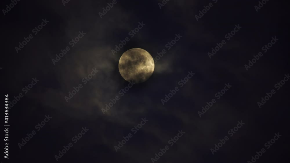 Creepy full moon behind clouds Creepy full moon behind clouds