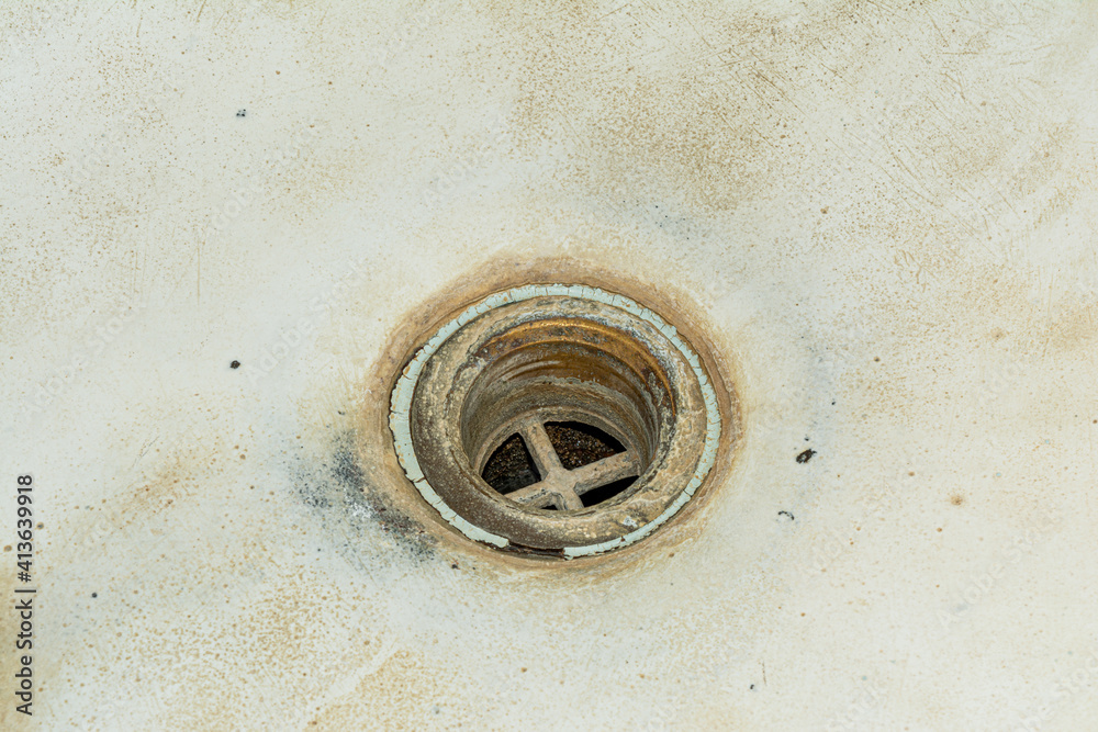 Terrible drain hole in the bathroom. Unsanitary condition of bath element close-up. Plumbing abstract background Terrible drain hole in the bathroom. Unsanitary condition of bath element close-up. Plumbing abstract background
