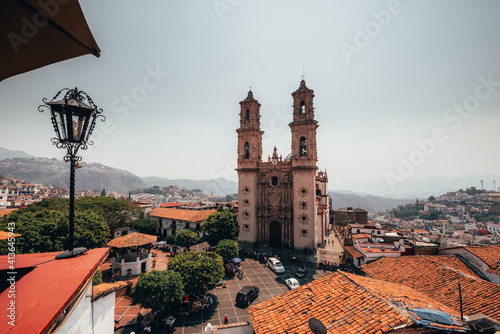 Church of Taxco, Guerrero, Mexico, seen from a building in front of it, of Baroque architecture.  photo