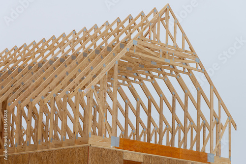 installation of rafters of a plywood house building wall studs