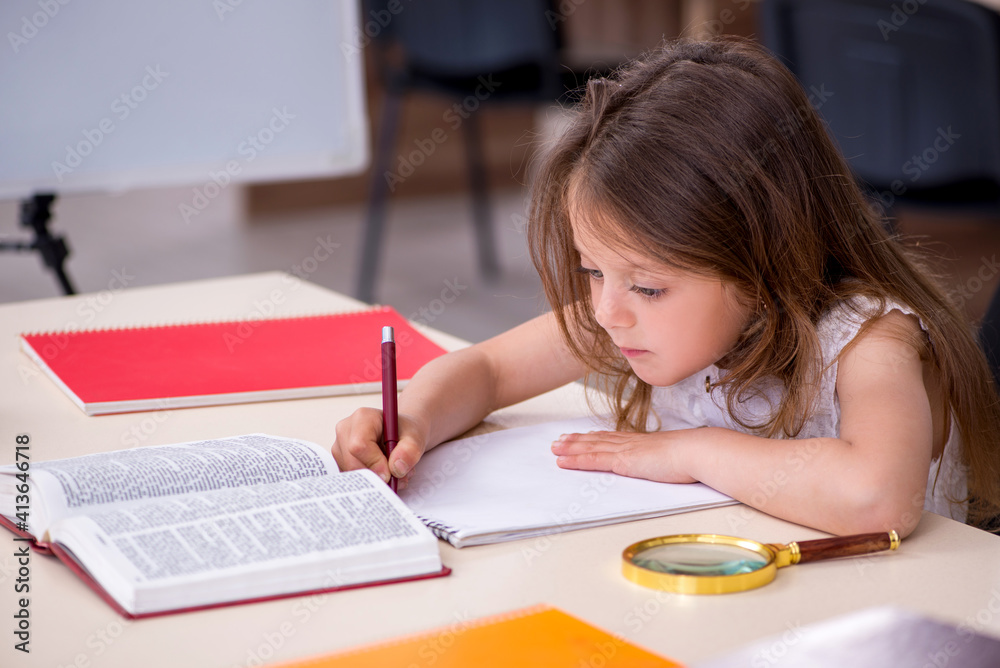 Small girl preparing for exams at home Small girl preparing for exams at home