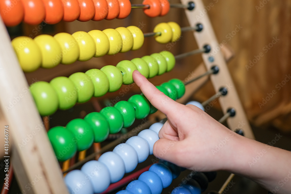 Primary school girl learning math using wood abacus at home,kids son education Primary school girl learning math using wood abacus at home,kids son education