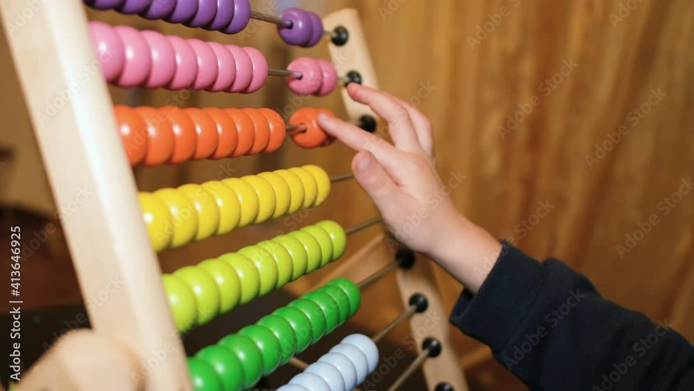 Primary school girl learning math using wood abacus at home,kids son education Primary school girl learning math using wood abacus at home,kids son education
