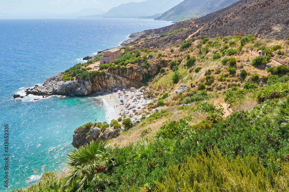 The paradise beach in Italy: perfect transparent turquoise water, white pebbles surrounded by greenery. The paradise beach in Italy: perfect transparent turquoise water, white pebbles surrounded by greenery.