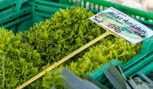 Lettuce for sale at farmers market, fresh and green, healthy food.
