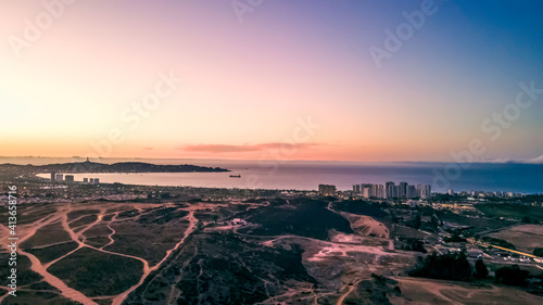 Aerial sunset shot of the sea avenue towards coquimbo, chile, drone photo