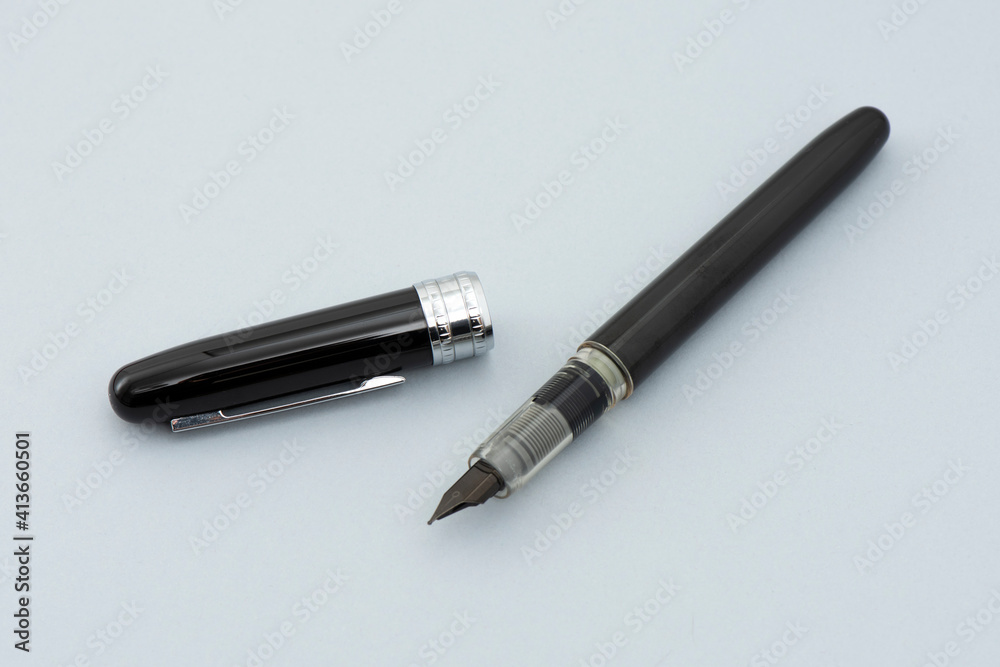 Black signature pen on the gray background. Black signature pen on the gray background.