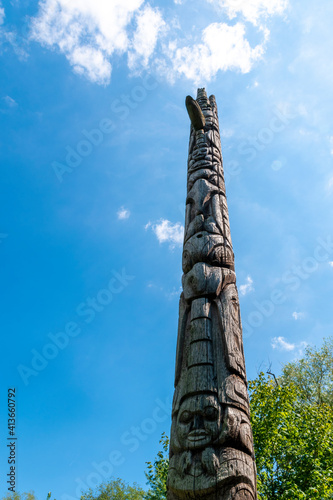 A totem pole stands tall on a beautiful sunny day in Thomson Memorial Park in Toronto (Scarborough), Ontario. © John