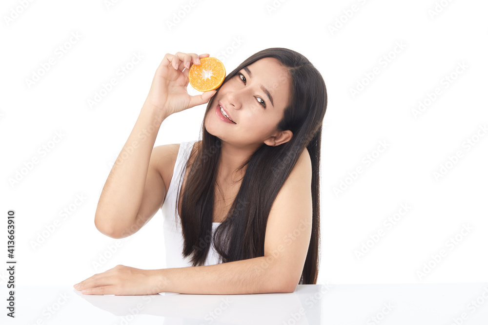 Portrait of a beautiful young woman with orange Portrait of a beautiful young woman with orange