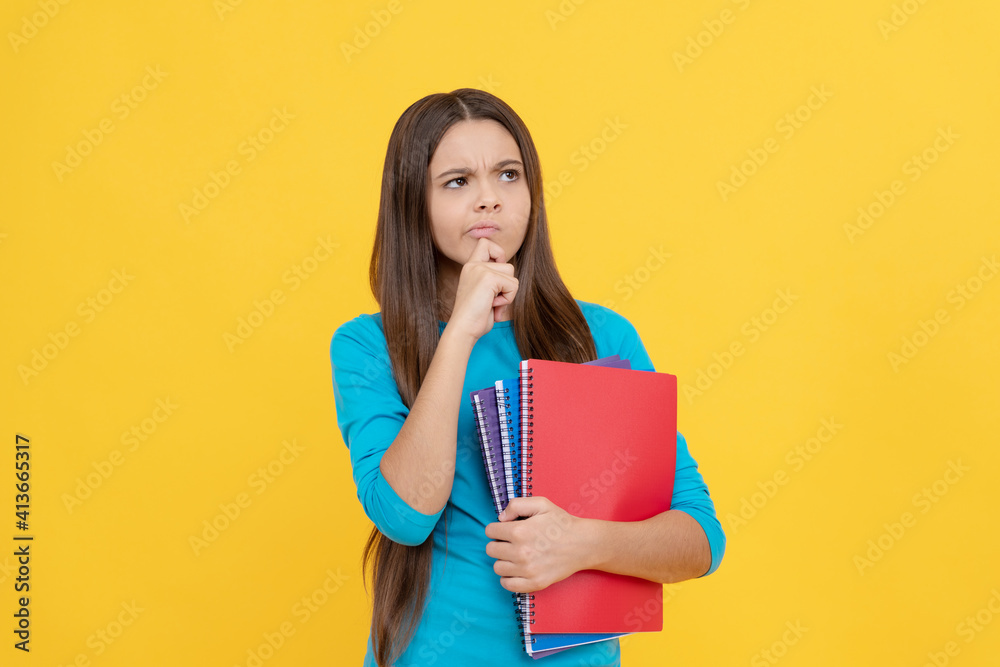 thoughtful child girl hold notepad for homework, school thoughtful child girl hold notepad for homework, school