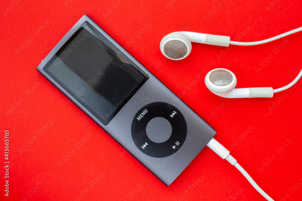 Calgary, Alberta, Canada. Feb 13, 2021. iPod Mini smaller digital audio  player that was designed and marketed by Apple. Photos | Adobe Stock