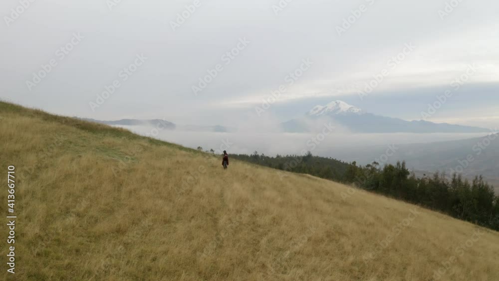 Silhouette Of A Man Above Misty Mountains. Aerial drone view of Andes. Silhouette Of A Man Above Misty Mountains. Aerial drone view of Andes.