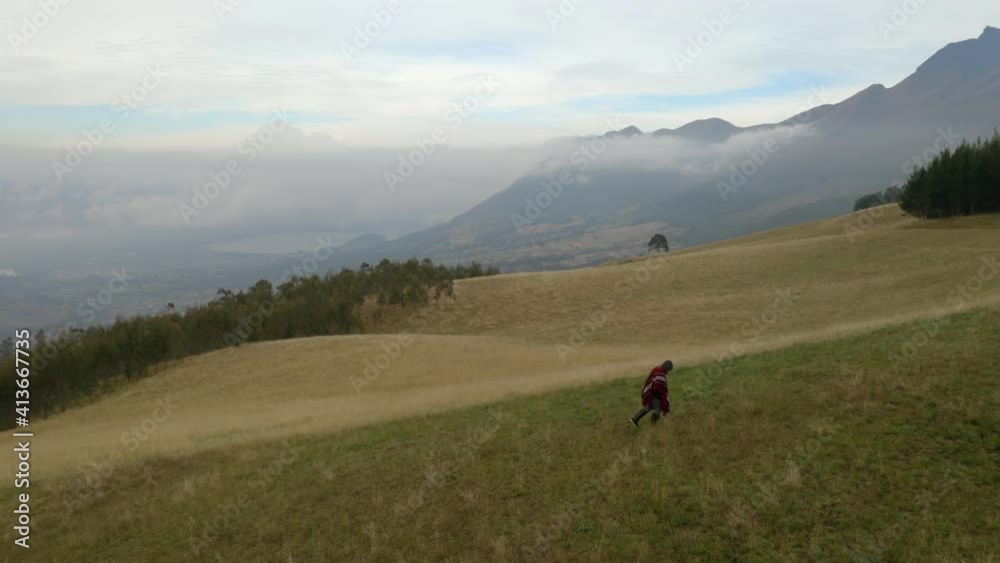 Silhouette Of A Man Above Misty Mountains. Aerial drone view of Andes. Silhouette Of A Man Above Misty Mountains. Aerial drone view of Andes.