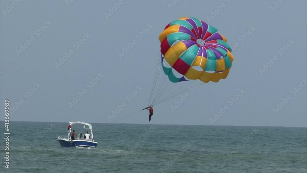 Tourists parasailing at Famous Playa De Bocagrande (Bocagrande beach) in Cartagena, Colombia. Tourists parasailing at Famous Playa De Bocagrande (Bocagrande beach) in Cartagena, Colombia.