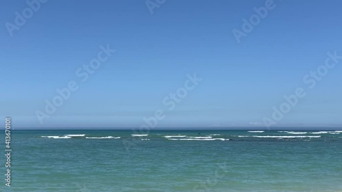 Rocky ocean of Strand beach blue ocean and blue skies photo