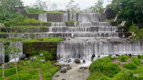 Grojogan Watu Purbo Waterfall in Sleman, Java, Indonesia, aerial close up photo