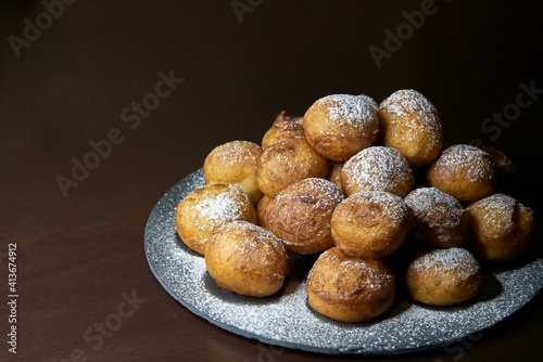 Homemade donuts stuffed filled with chocolate with glass sugar photo