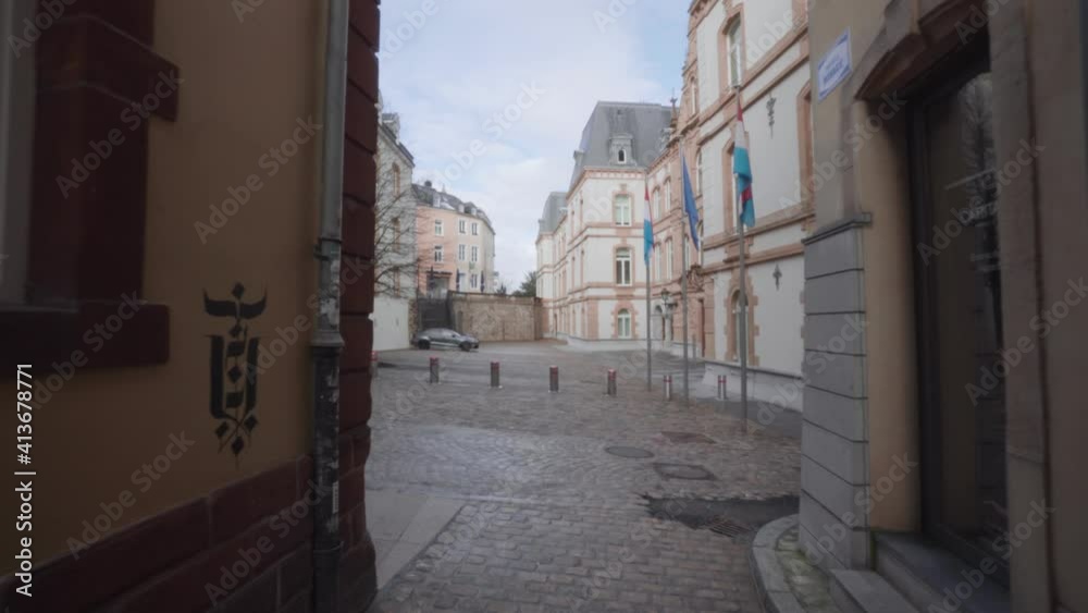 POV walk along empty streets in Luxembourg City, ghost town because of pandemic Coronavirus lockdown. In the background the flag of Luxembourg and the European Union (EU) POV walk along empty streets in Luxembourg City, ghost town because of pandemic Coronavirus lockdown. In the background the flag of Luxembourg and the European Union (EU)