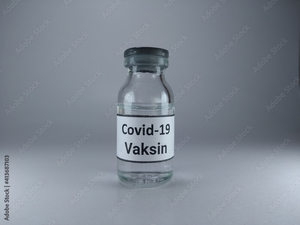 The word Covid 19 vaccine written in Indonesian language on a vaccine bottle The word Covid 19 vaccine written in Indonesian language on a vaccine bottle