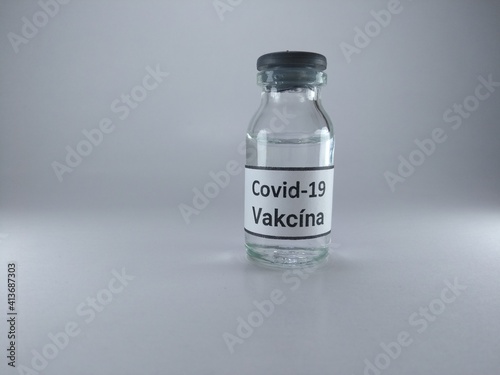 The word Covid 19 vaccine written in Czech language on a bottle of vaccine 