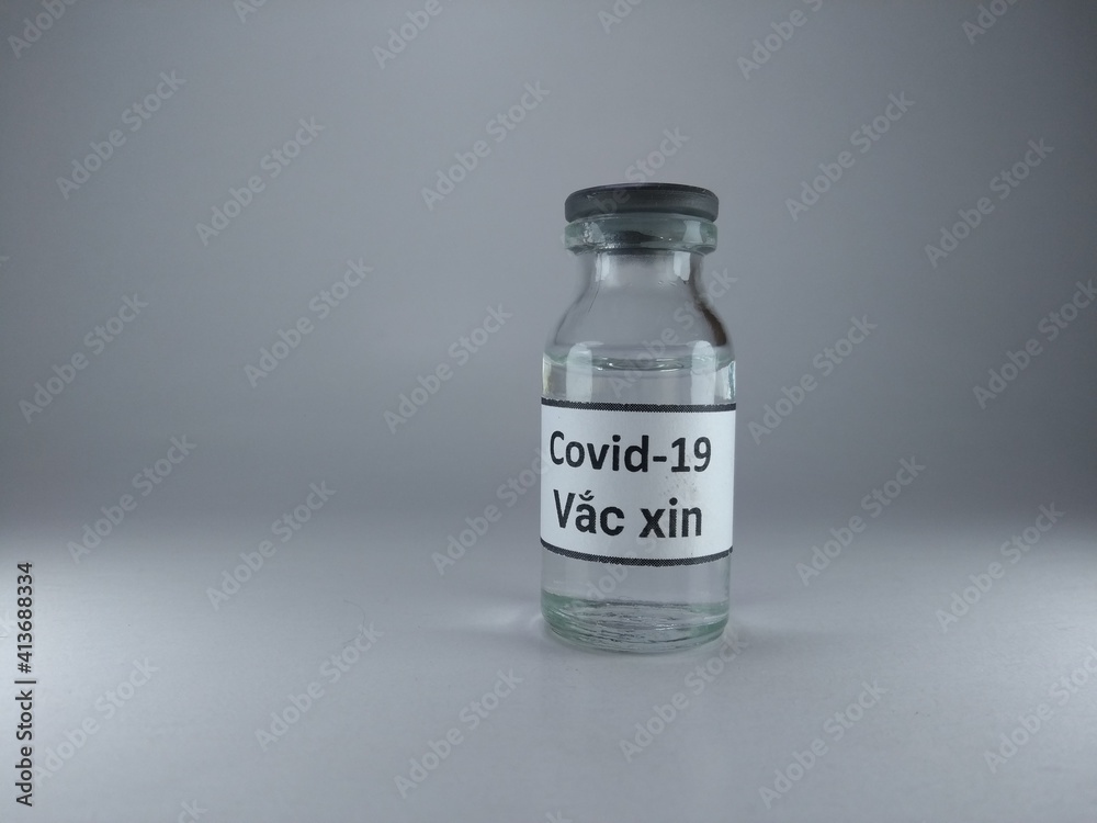 Covid 19 vaccine written in Vietnamese language on a vaccine bottle Covid 19 vaccine written in Vietnamese language on a vaccine bottle