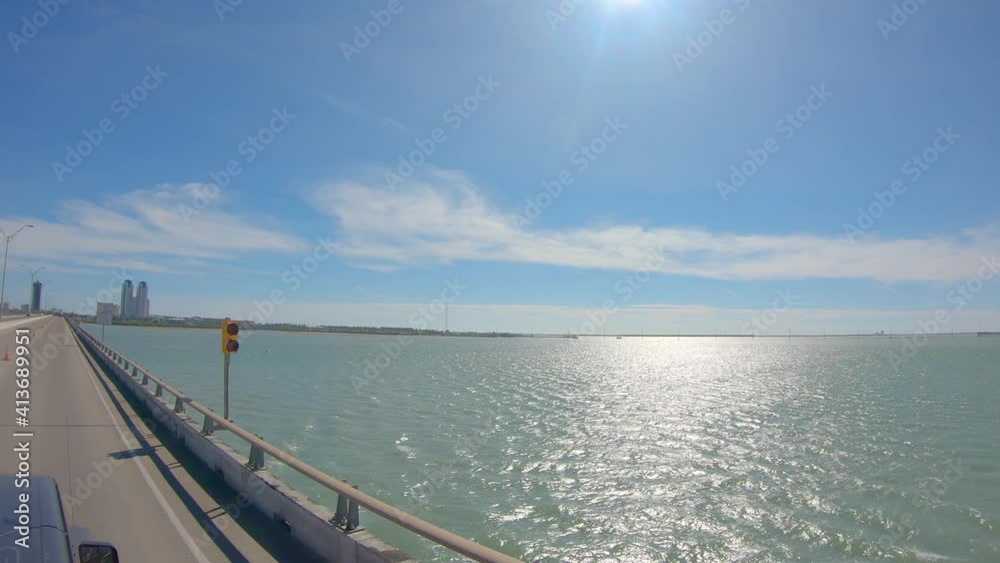 POV from roof top while driving on Queen Isabella Causeway over the Laguna Madre at South Padre Island, Texas POV from roof top while driving on Queen Isabella Causeway over the Laguna Madre at South Padre Island, Texas