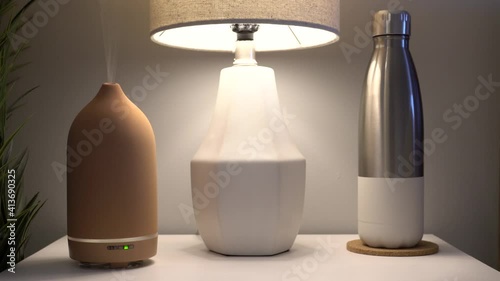 Essential oils diffuser humidifier for aroma therapy at home spa wellness; close up photo