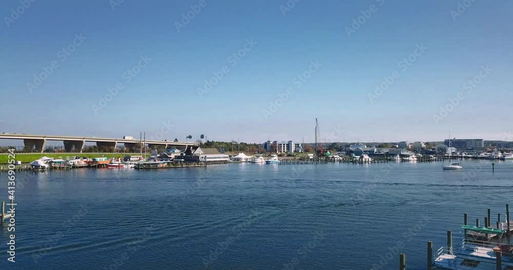 Kent Narrows, MD waterway shot overhead with DJI Mavic Pro drone with low speed movement in 4K 24fps. Rising from marina, revealing more shoreline Kent Narrows, MD waterway shot overhead with DJI Mavic Pro drone with low speed movement in 4K 24fps. Rising from marina, revealing more shoreline