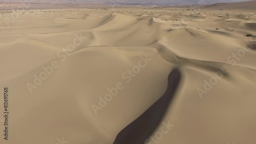Sanddunes as far as you can see in the desert of california photo