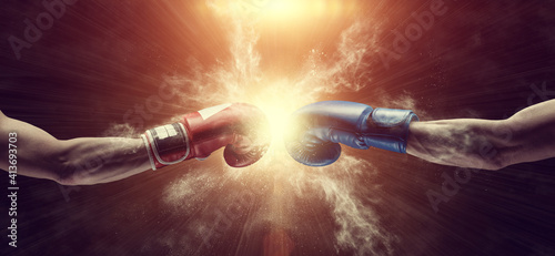 Two male hands in boxing gloves. Sports confrontation. © BortN66