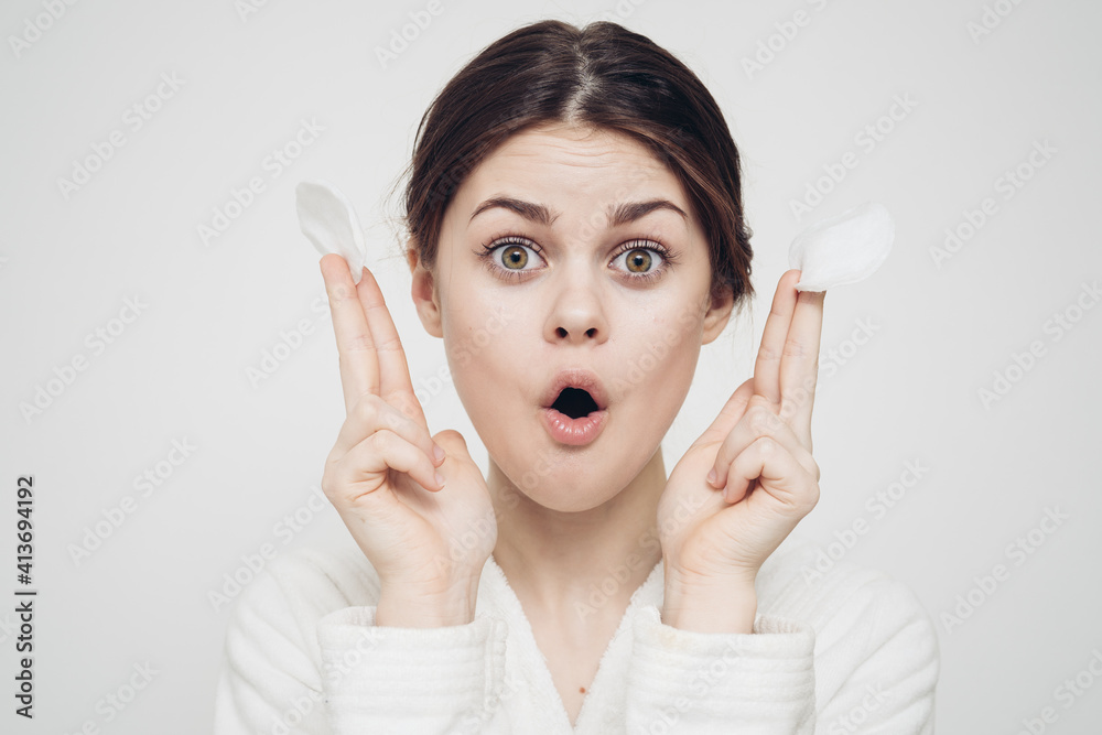 emotional woman with sponges in hands clean skin cosmetology dermatology emotional woman with sponges in hands clean skin cosmetology dermatology
