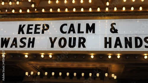 Keep Calm and Wash Your Hands Sign at Entrance of Closed Theatre During Covid-19 Virus Lockdown in USA, Close Up