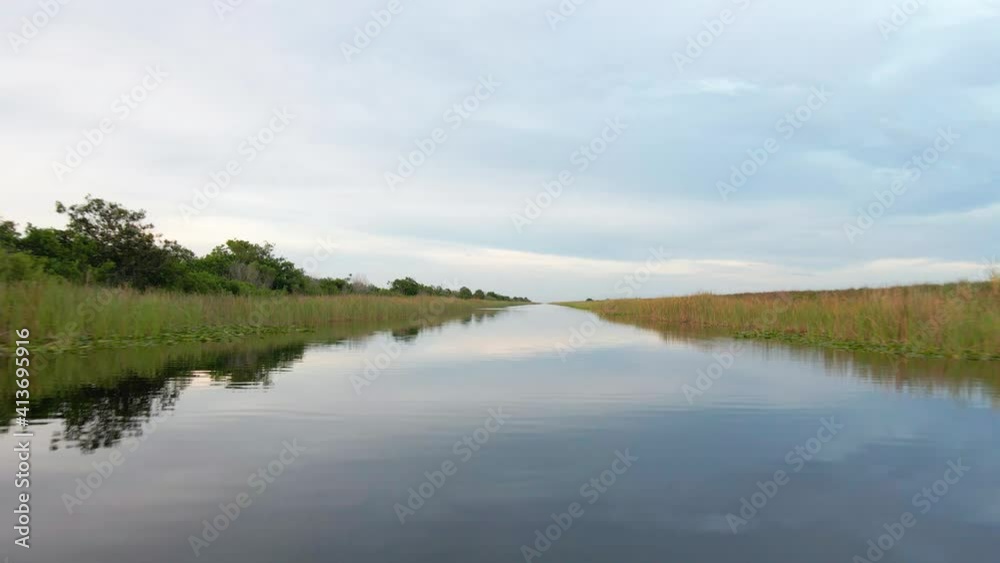 Aerial view over mirroring waters in Everglades, Florida, USA - Low, drone shot Aerial view over mirroring waters in Everglades, Florida, USA - Low, drone shot