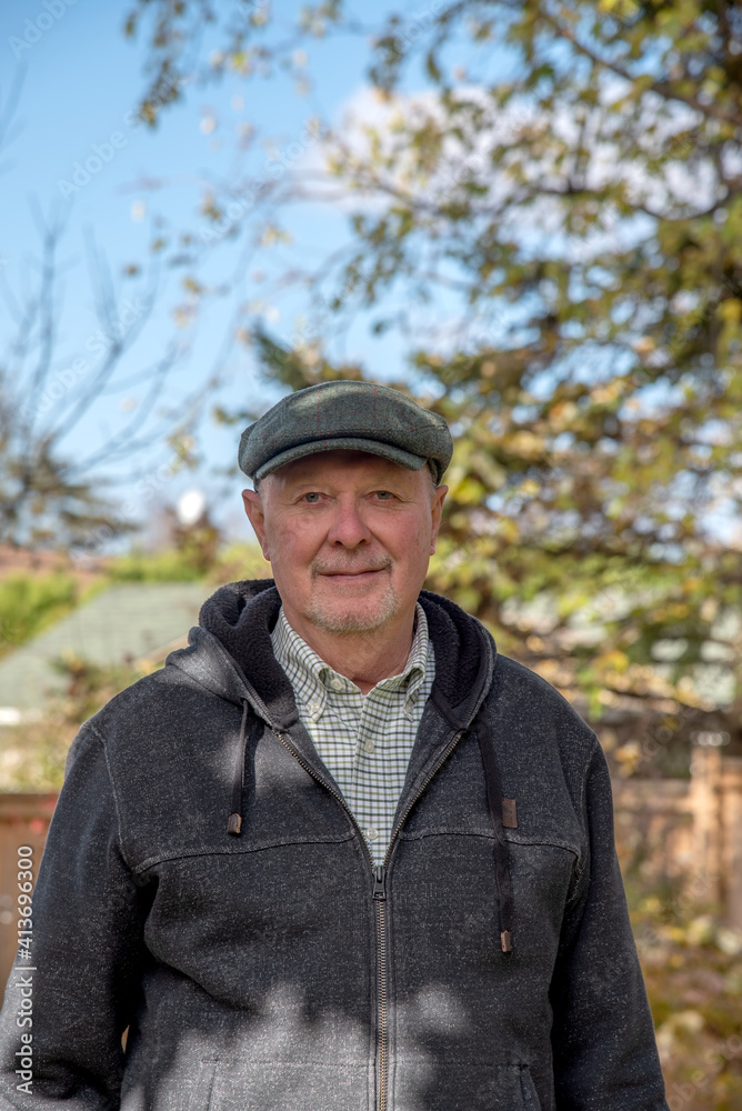 Portrait of a senior gay man outdoors in autumn. Portrait of a senior gay man outdoors in autumn.