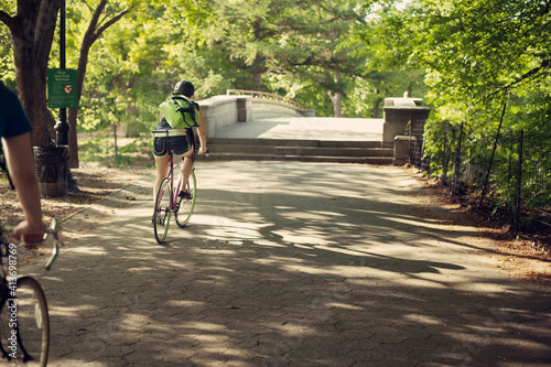 Wallpaper Mural Friends cycling on street at park Torontodigital.ca