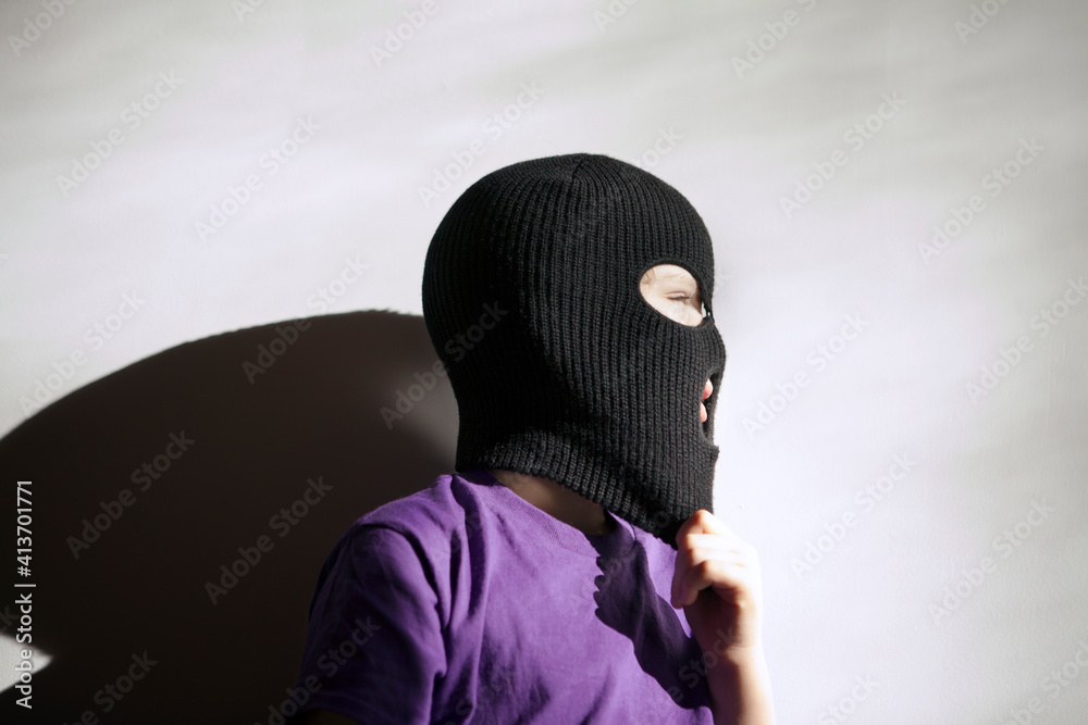 Boy wearing mask while standing against wall Boy wearing mask while standing against wall