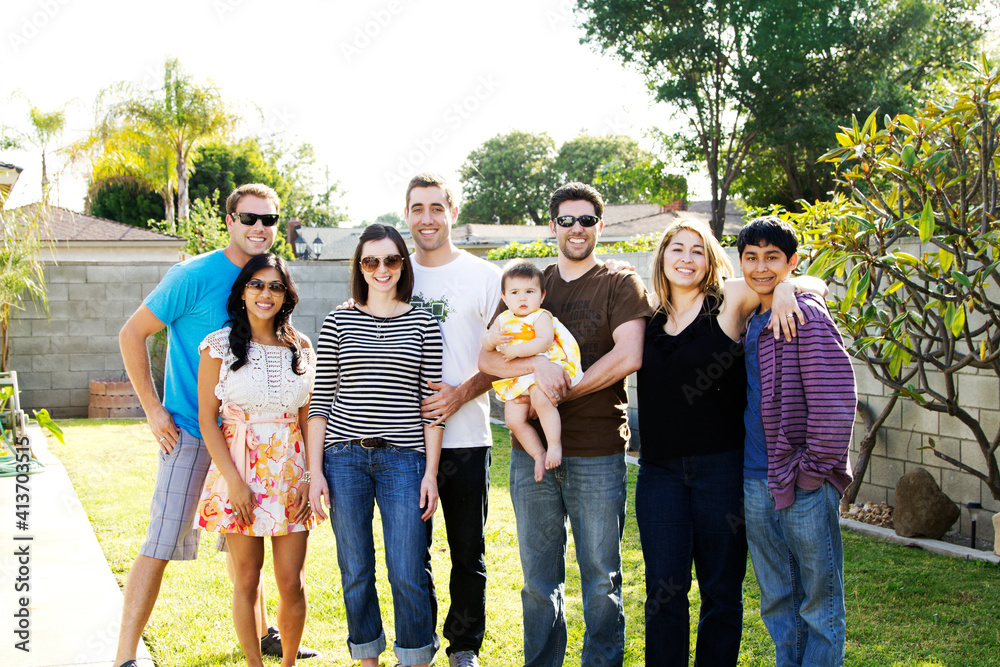 Portrait of happy friends standing at backyard Portrait of happy friends standing at backyard