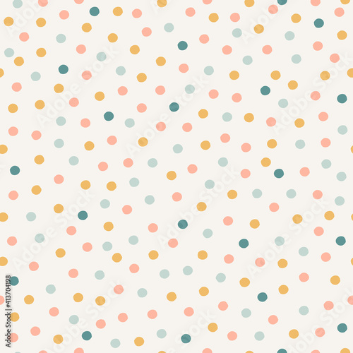 Pastel confetti seamless pattern. Neutral hand-drawn polka dot texture background.