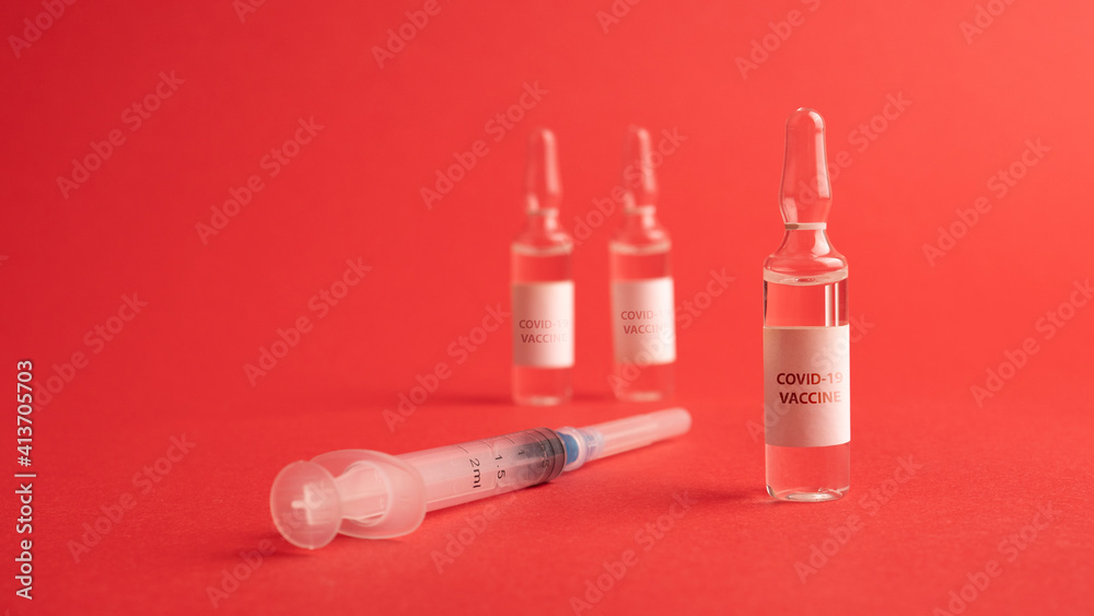 Vaccine vial dose flu shot drug needle syringe,medical concept vaccination hypodermic injection treatment disease care hospital prevention immunization illness disease baby child.blue background Vaccine vial dose flu shot drug needle syringe,medical concept vaccination hypodermic injection treatment disease care hospital prevention immunization illness disease baby child.blue background