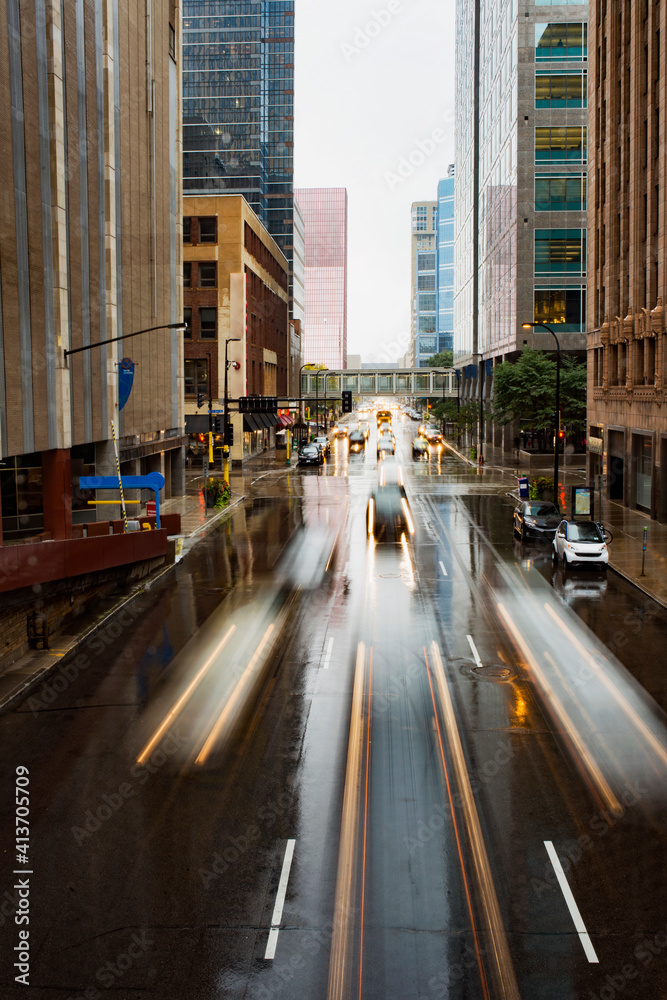 Long exposure of vehicles moving on city street during rainy season Long exposure of vehicles moving on city street during rainy season