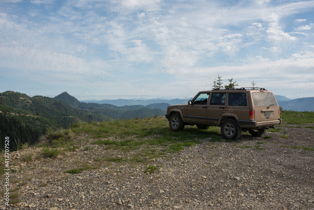 Car parked on mountain against cloudy sky Car parked on mountain against cloudy sky