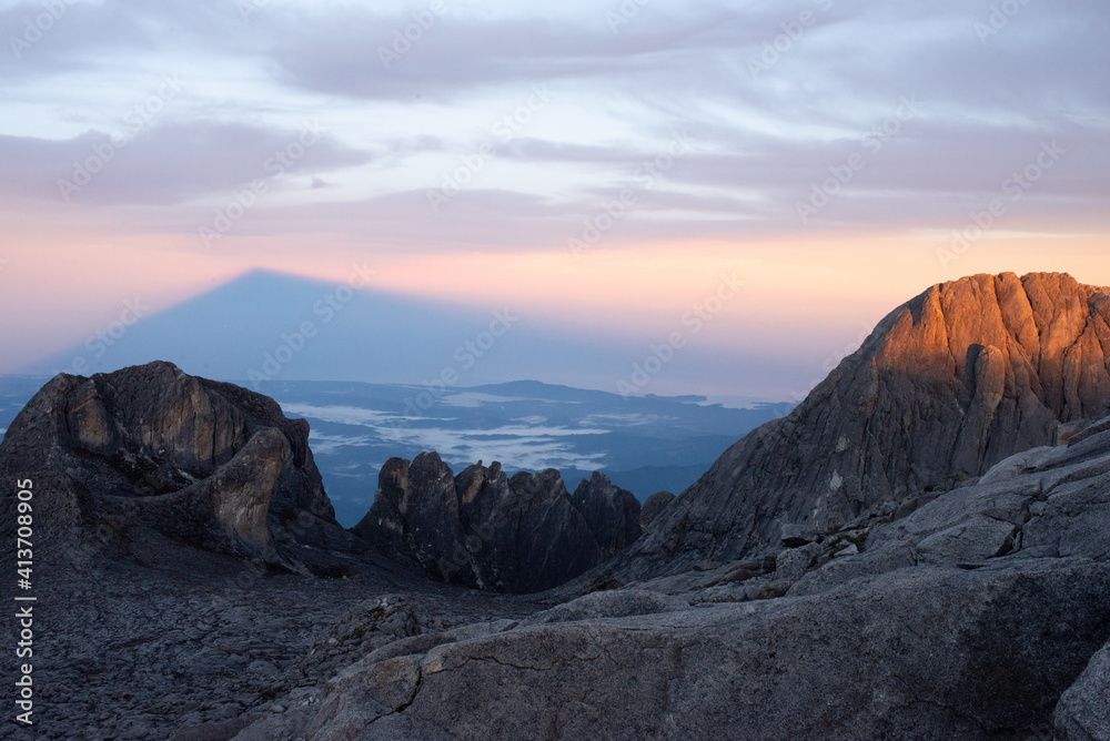 Fototapeta premium stone and sun rising in Mount Kinabalu
