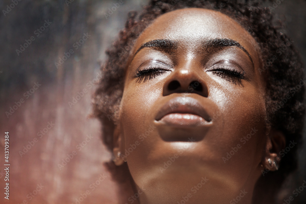 Close-up of woman with eyes closed leaning on wall Close-up of woman with eyes closed leaning on wall
