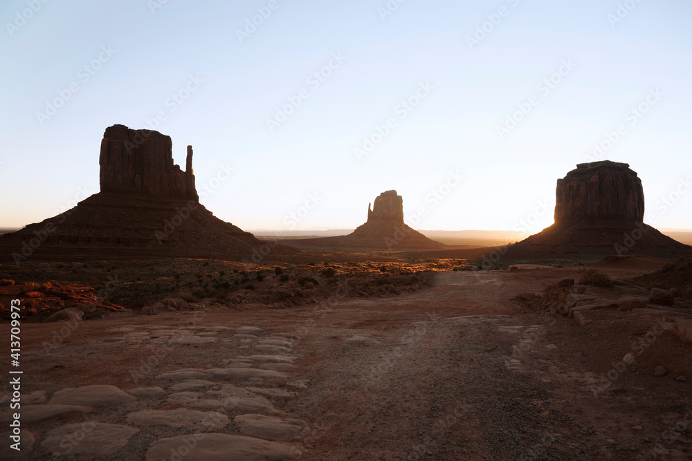 Monument Valley against clear sky during sunset Monument Valley against clear sky during sunset