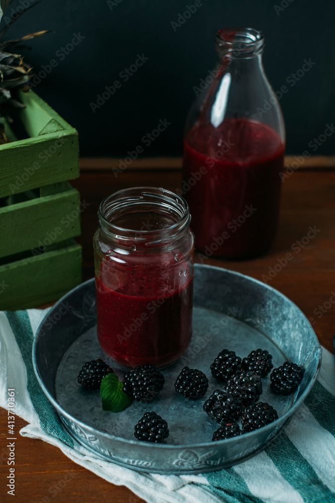 High angle view of drinks with blackberries on table High angle view of drinks with blackberries on table